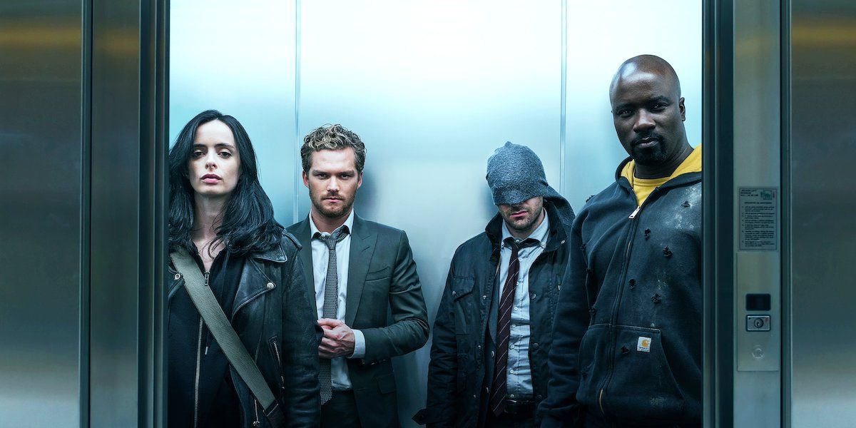 Krysten Ritter, Finn Jones, Charlie Cox and Mike Colter in an elevator in The Defenders.