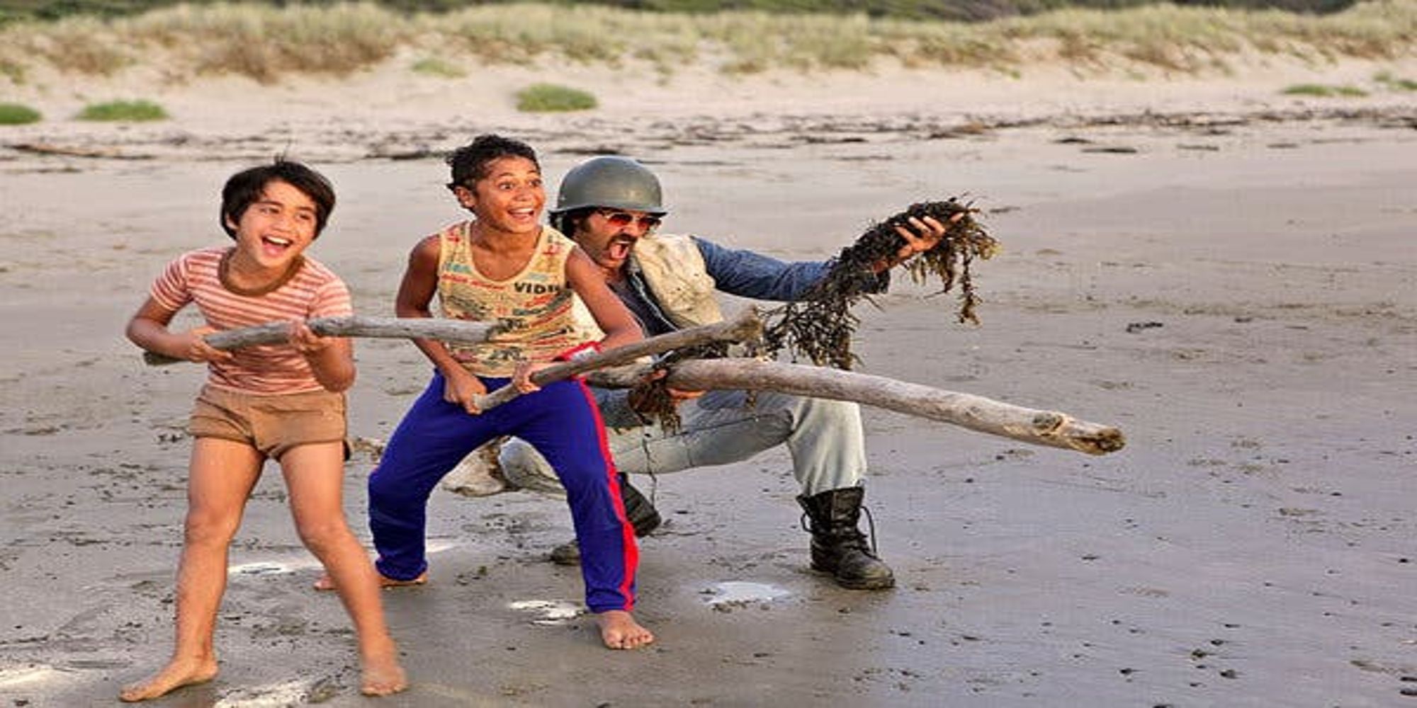 A boy, his brother and father in Taika Waititi's movie Boy.
