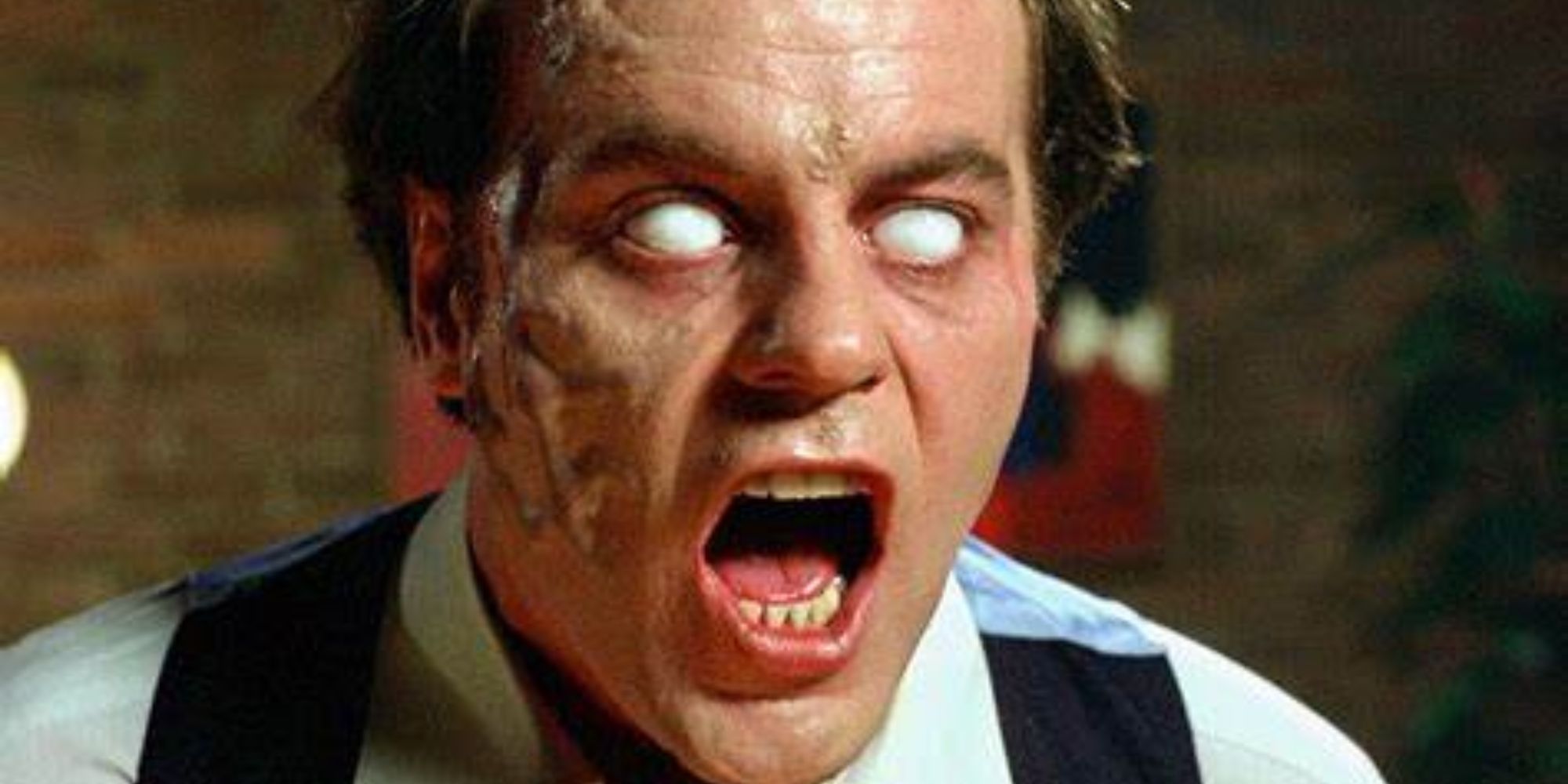 Darryl Revok, played by Michael Ironside, with white eyes and an open mouth in Scanners.