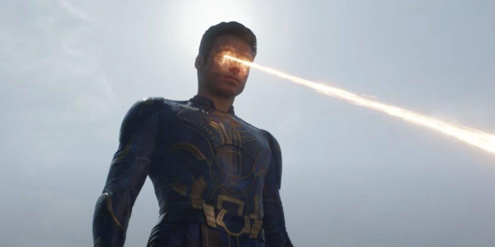 Richard Madden as Ikaris, using his golden yellow energy blasts in The Eternals.