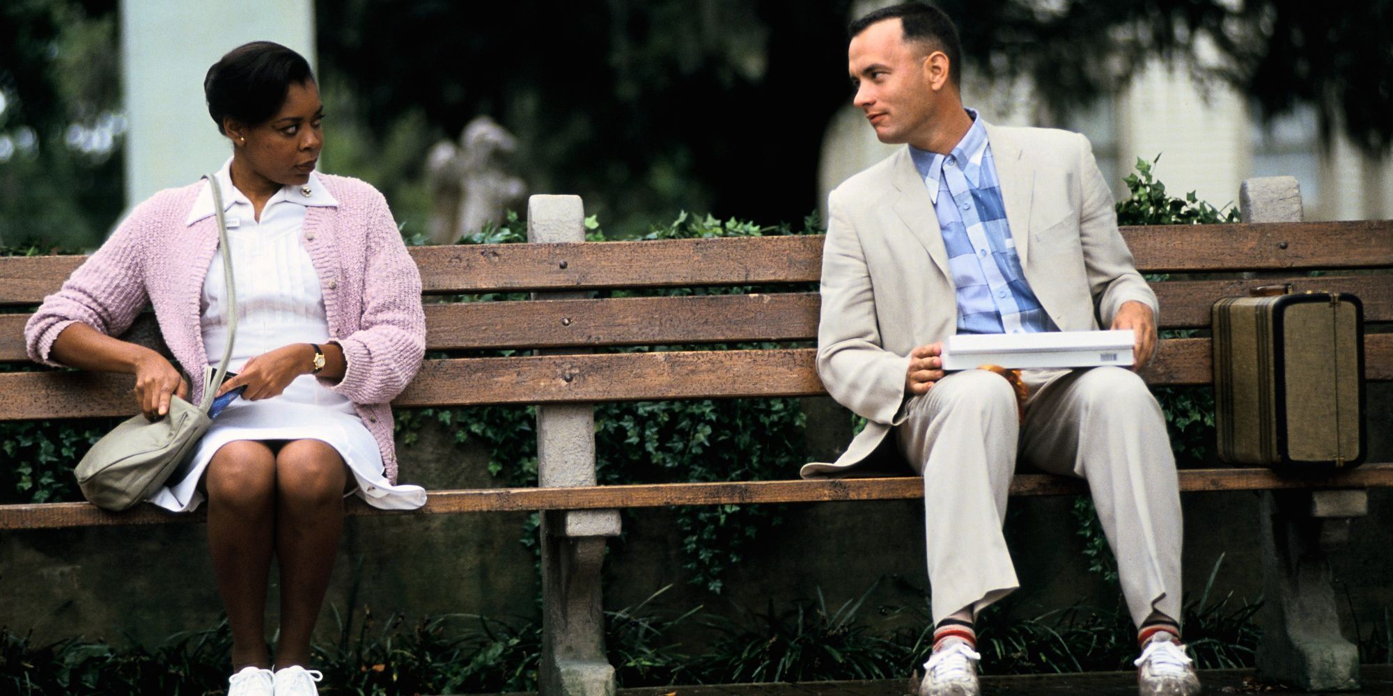Forrest sits next to a woman in Forrest Gump.