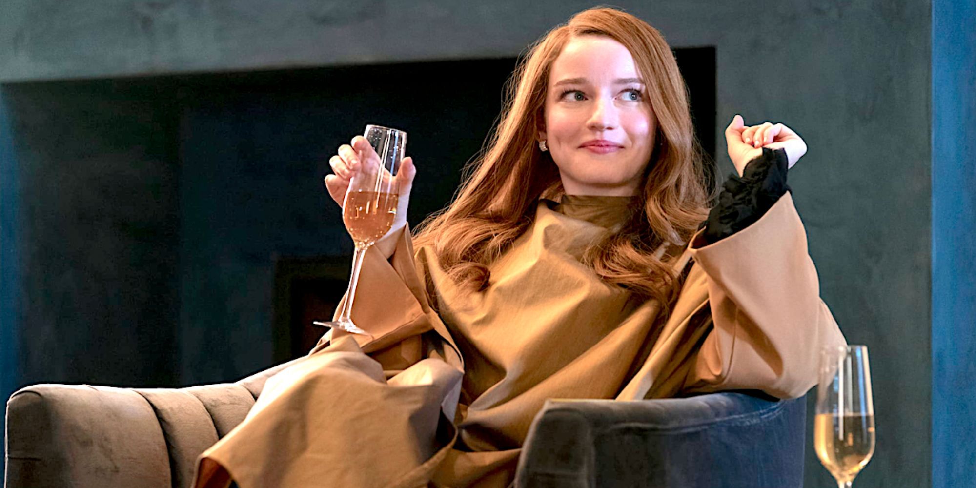 Julia Garner as Anna Delvey sips champagne with a smirk