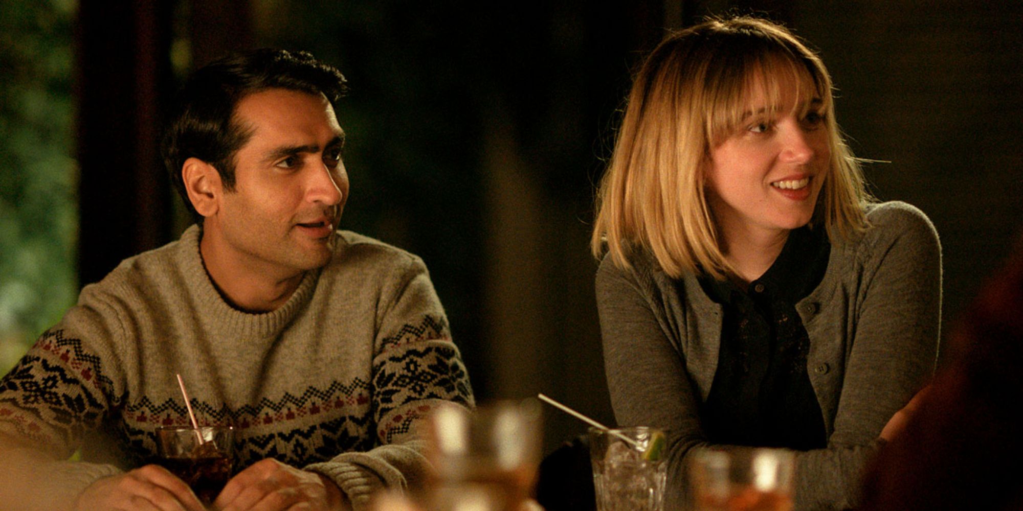 Kumal Nanjiani and Zoe Kazan as Kumail and Emily at the dinner party in Big Sick.