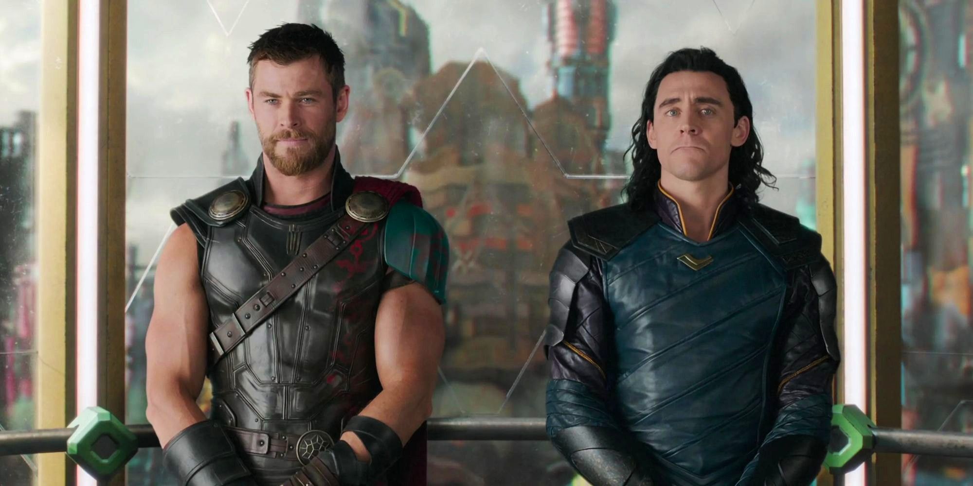 Tom Hiddleston and Chris Hemsworth as Thor and Loki stand side by side in an elevator in Thor: Ragnarok.