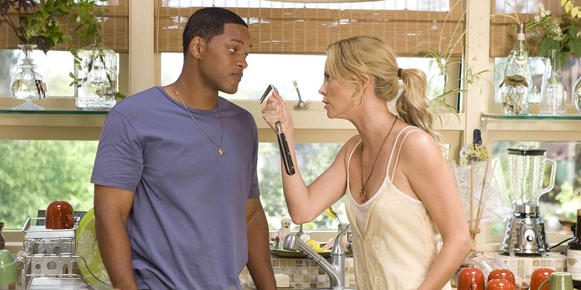 Charlize Theron points kitchen appliance at Will Smith in Hancock