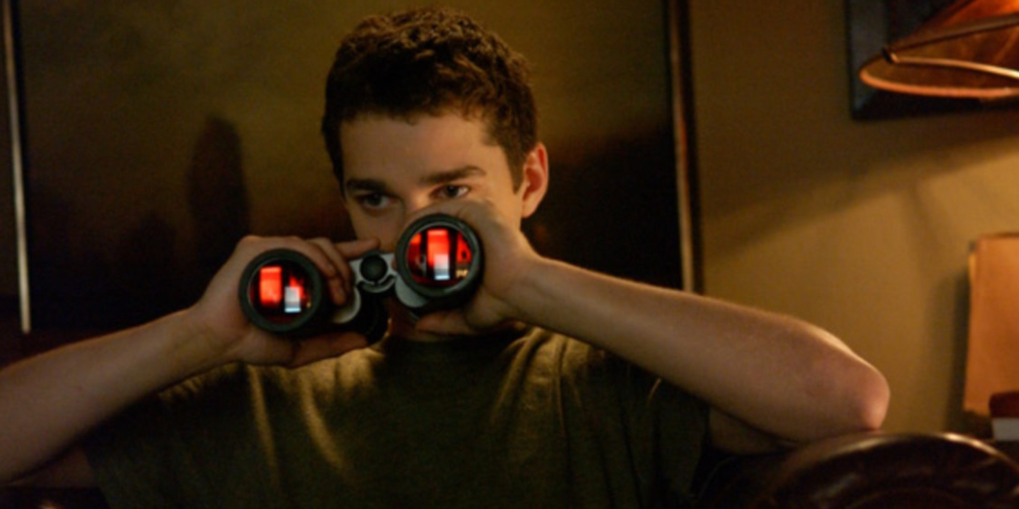 Shia LaBeouf as Kale uses binoculars in Disturbia