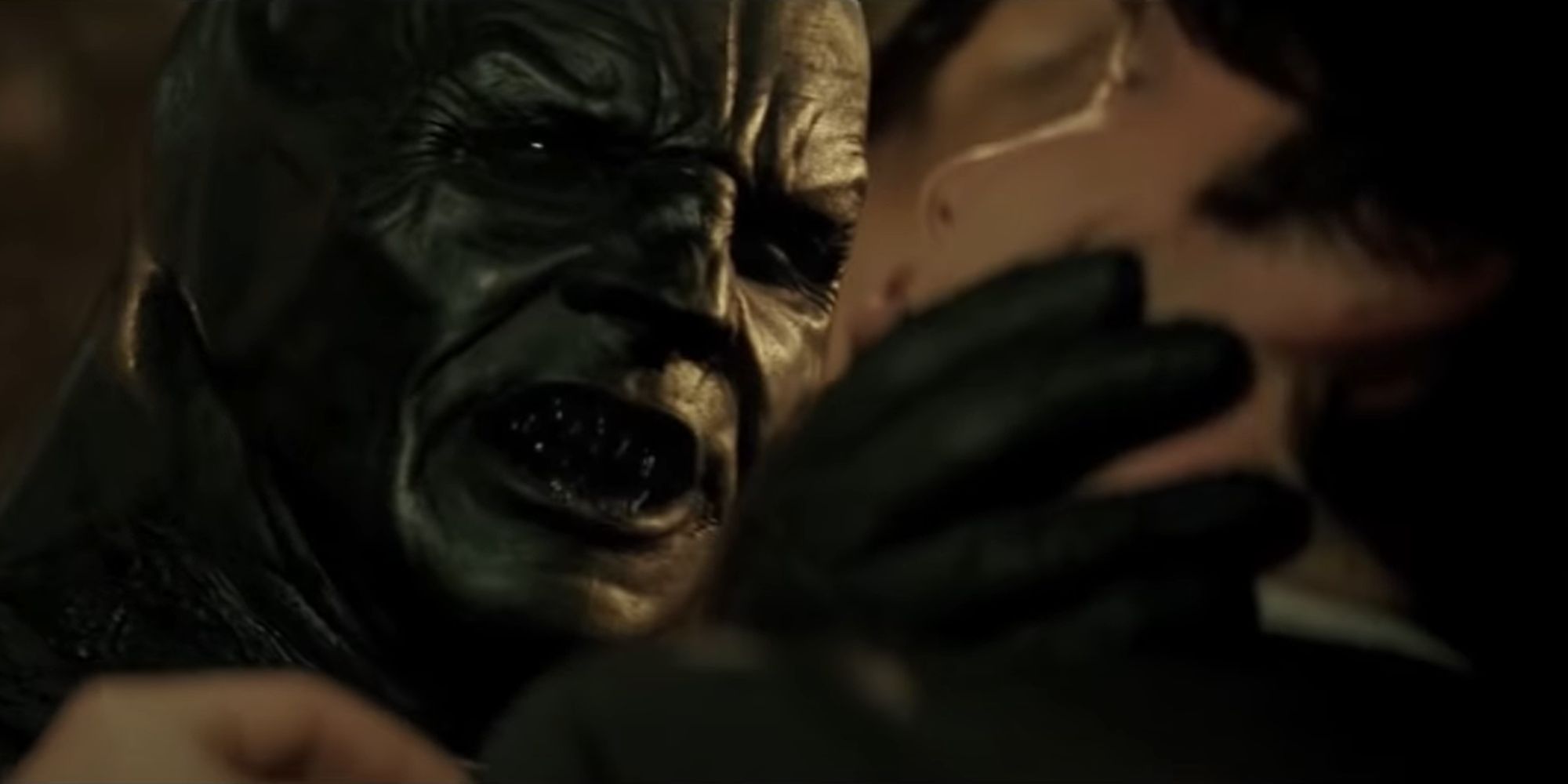 Batman interrogates a drugged Scarecrow in the form of a demon.