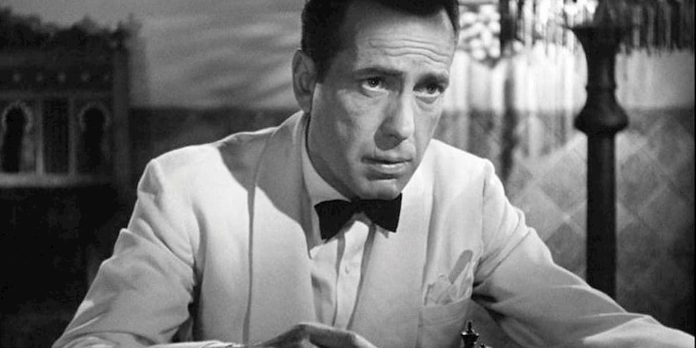 Humphrey Bogart as Rick Blaine is seriously looking at something off-screen in Casablanca.