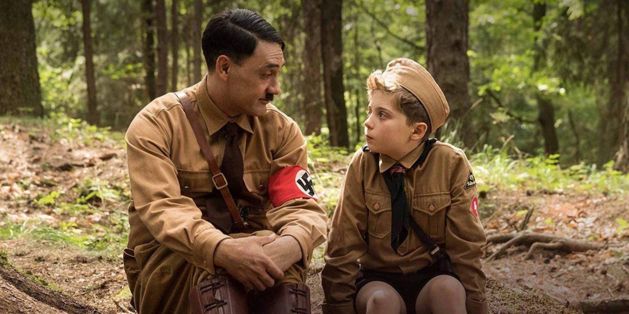 Jojo sits with imaginary Hitler in Jojo Rabbit (2019) 