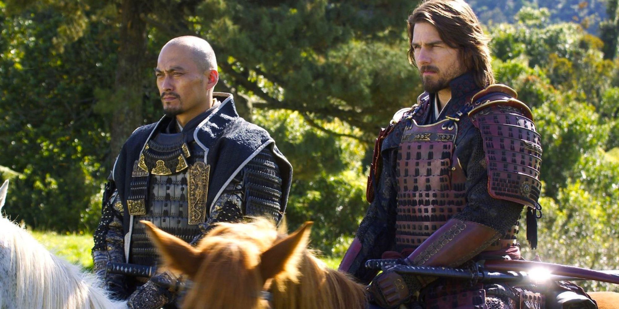 two men on horseback stand side by side