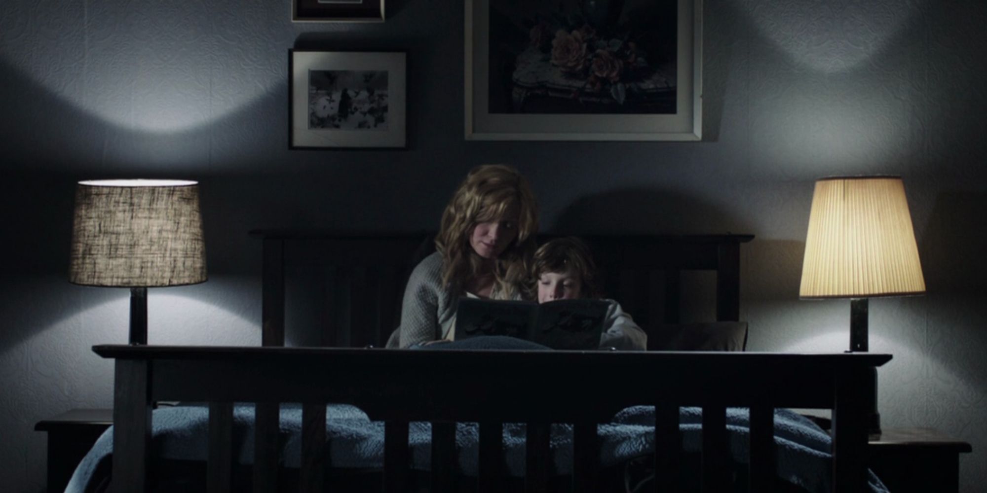 Essie Davis and Noah Wiseman in bed with lights while reading a story