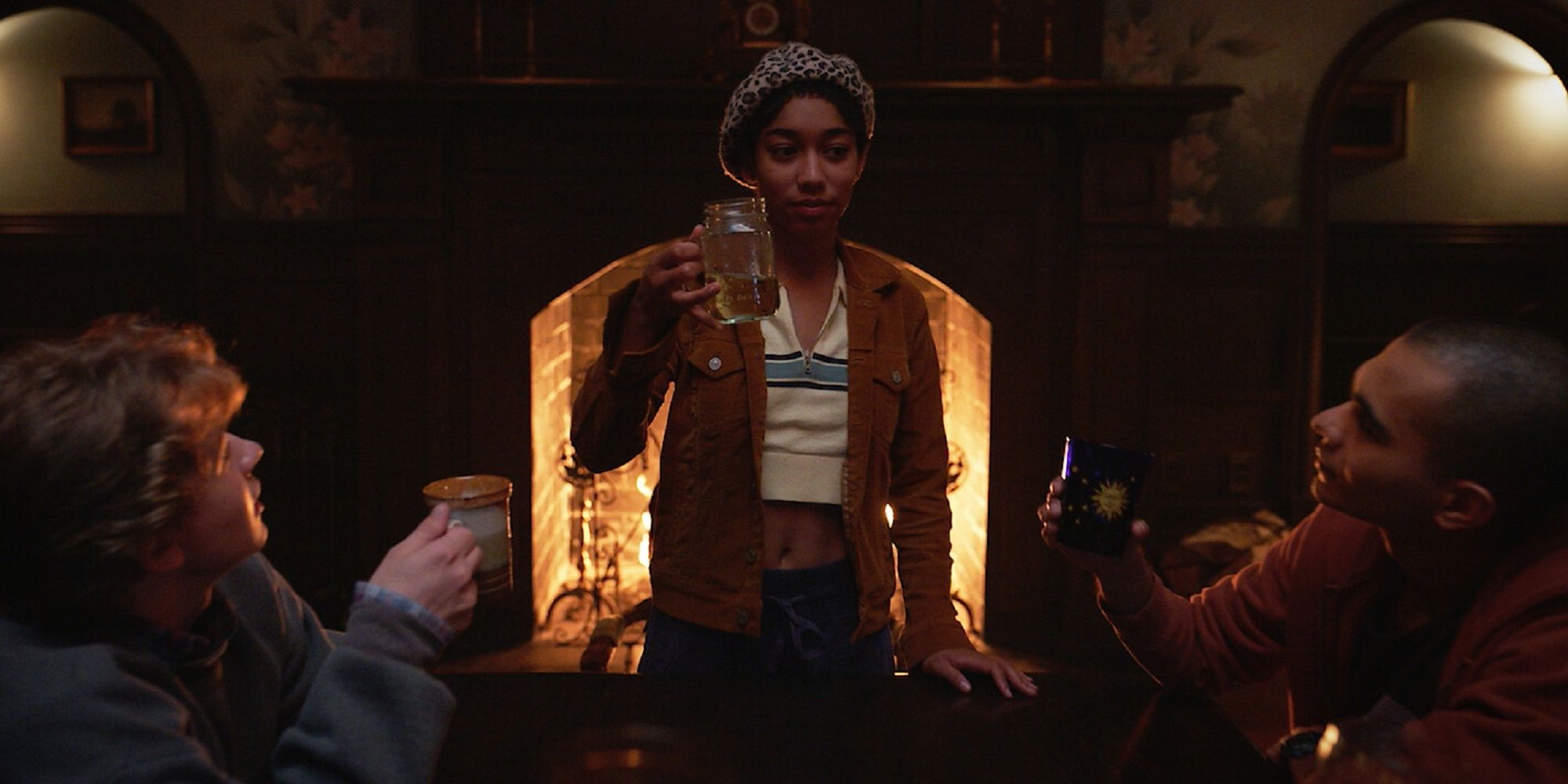 The character Iman Benson holds her glass to greet her friends' drinks at the Midnight Club.