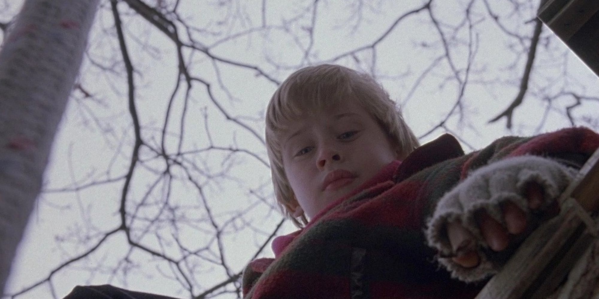 Little blond boy looking down at the audience