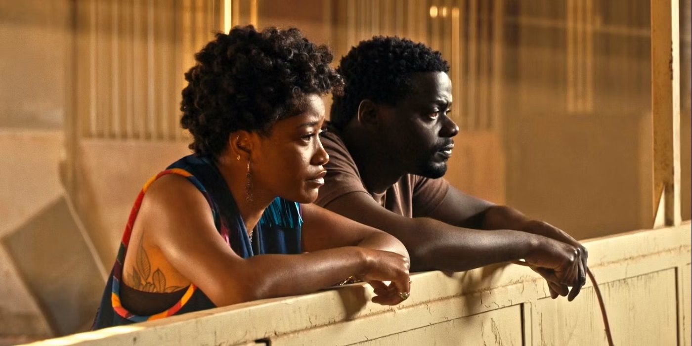 Keke Palmer as Emerald and Daniel Kaluuya as O.J.  stand and look in the shed at Netu.