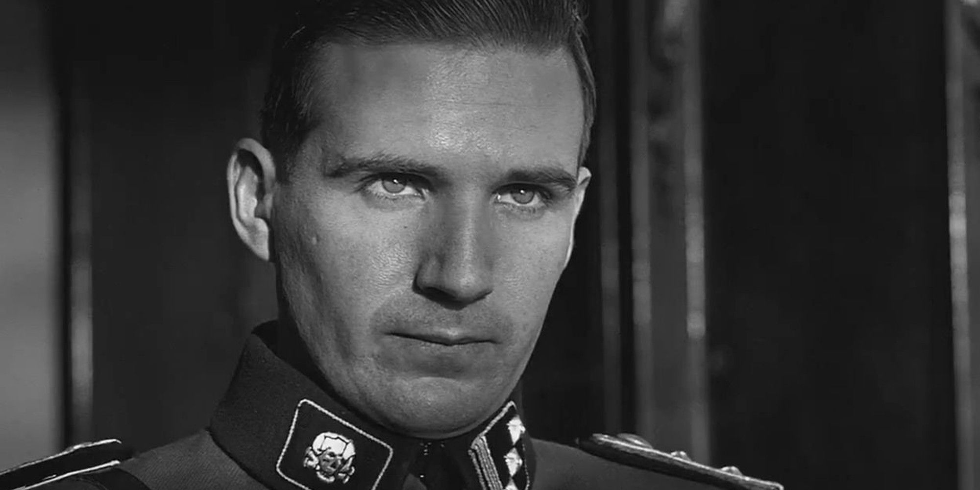 Amon Goeth looks closely at Schindler's List