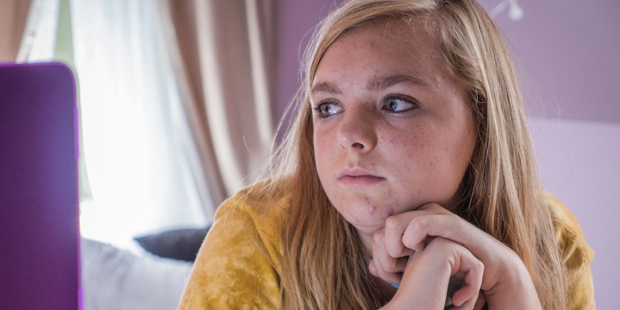 Kayla lies in bed and looks to the right in eighth grade.