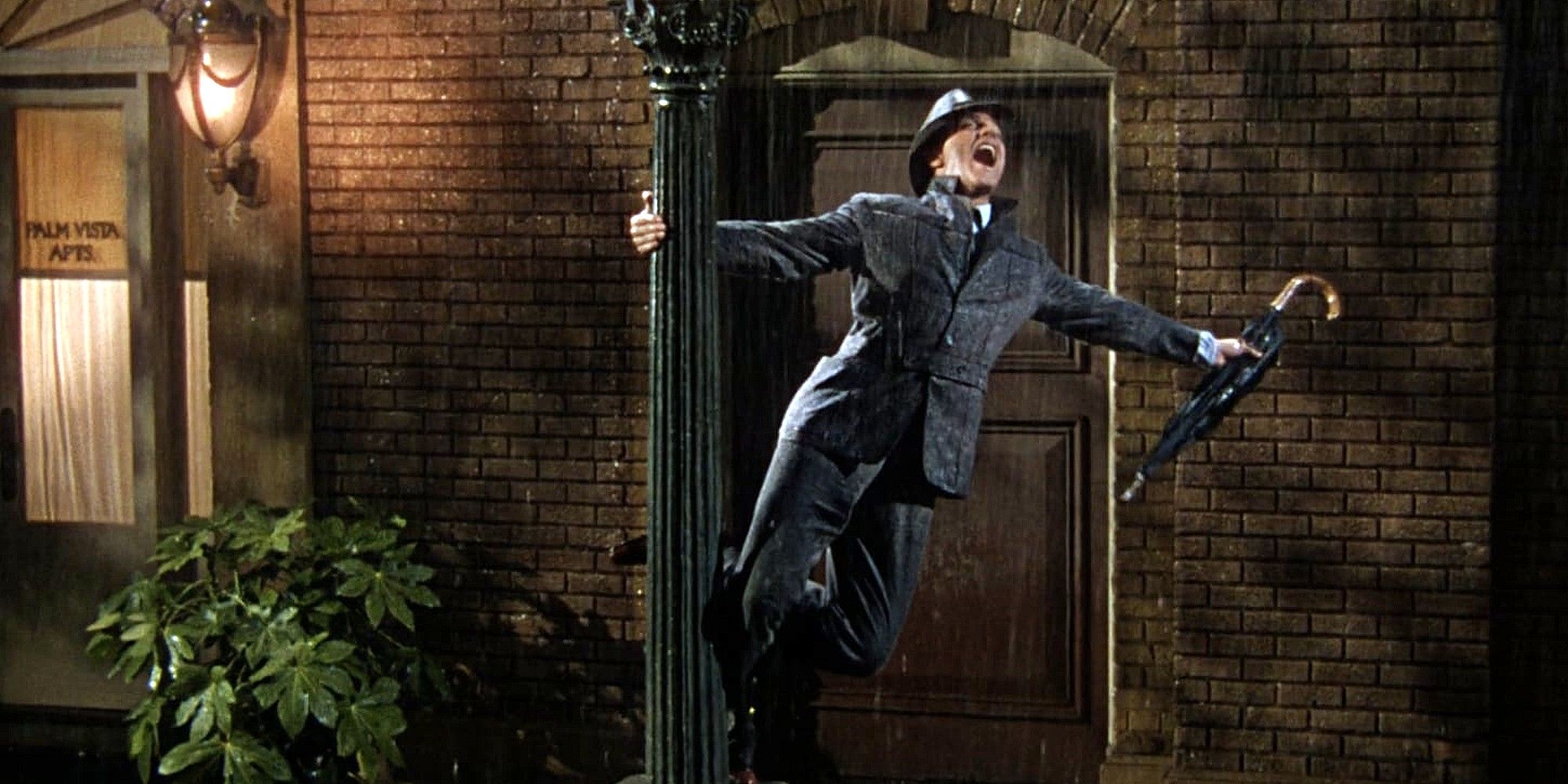 Gene Kelly dances with an umbrella in Singing in the Rain.