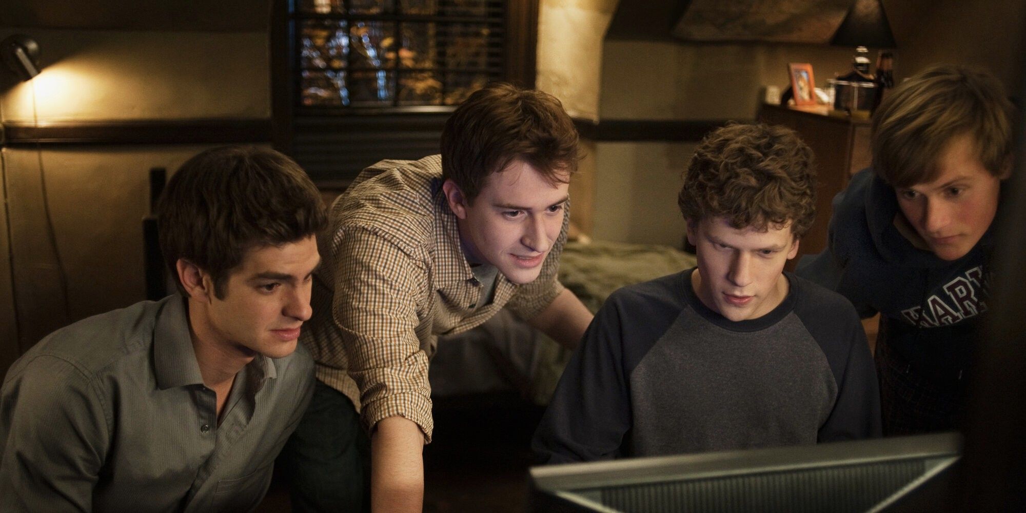 Joseph Mazzello, Jesse Eisenberg, Andrew Garfield and Patrick Mapel in The Social Network