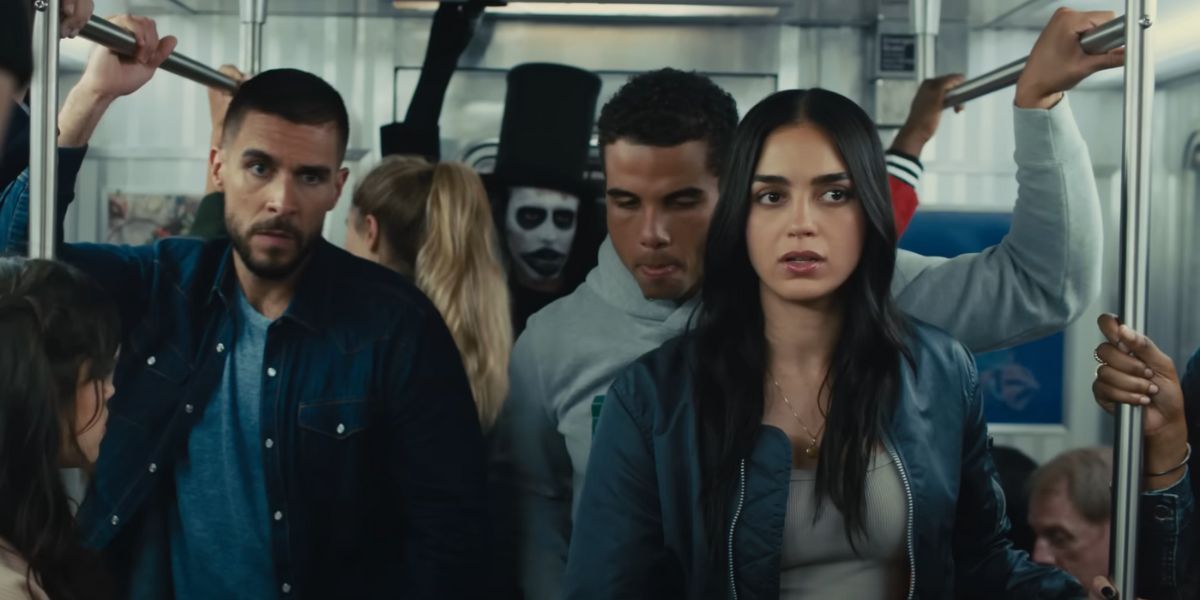 Melissa Barrera, Josh Segarra and Mason Gooding on the subway with the Babadook behind them in Scream VI.