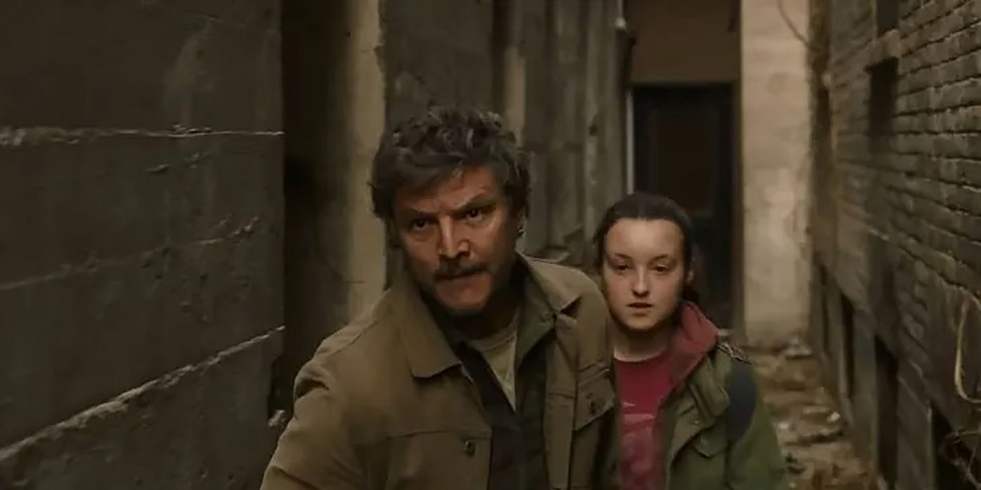 Joel leads Ellie down an abandoned alleyway in The Last of Us.