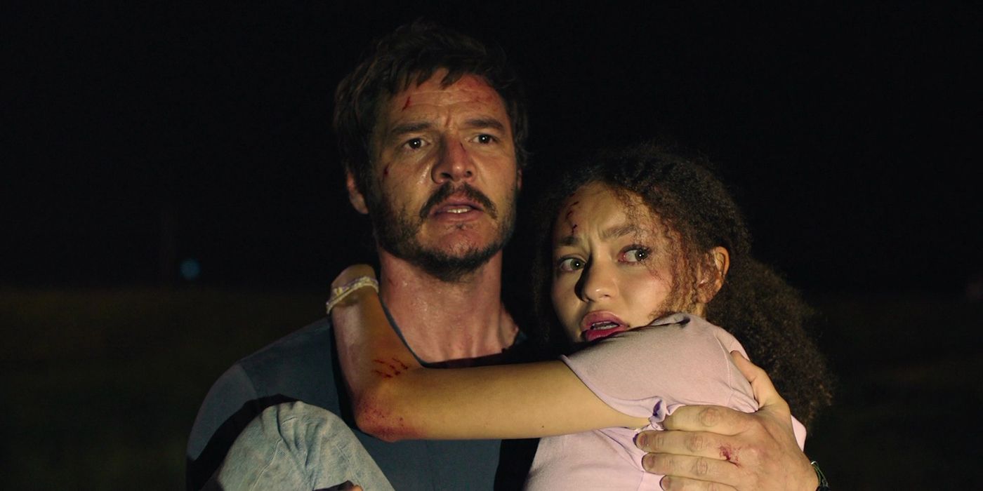 Joel carries a terrified Sarah in The Last of Us.