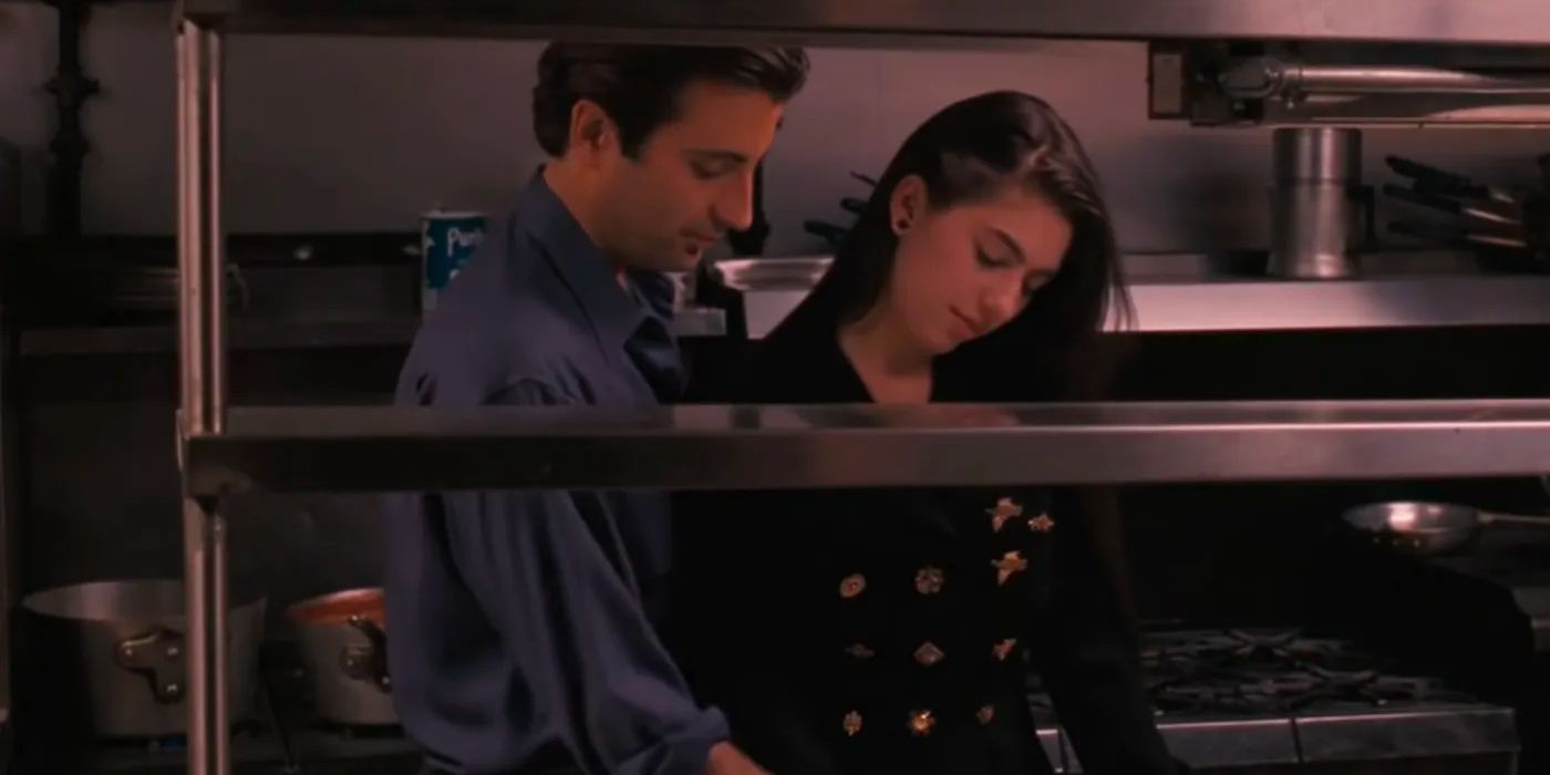 Two young lovers are cooking with each other. 