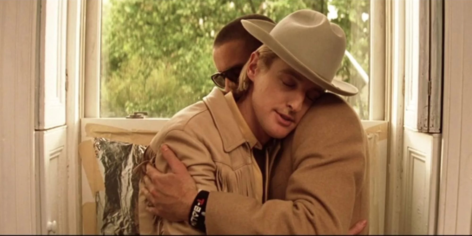 Owen Wilson and Luke Wilson embrace in The Tenenbaum Royals.