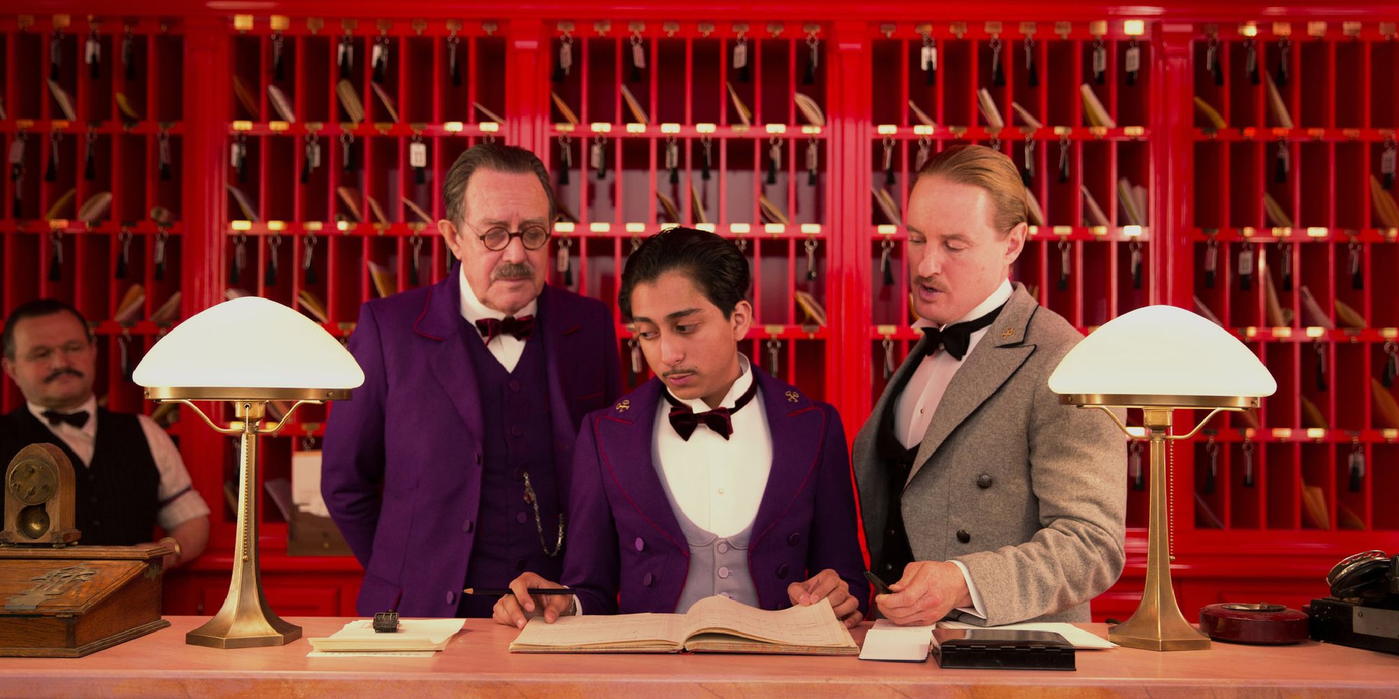 Owen Wilson and Tony Revolori look towards the Grand Budapest Hotel.