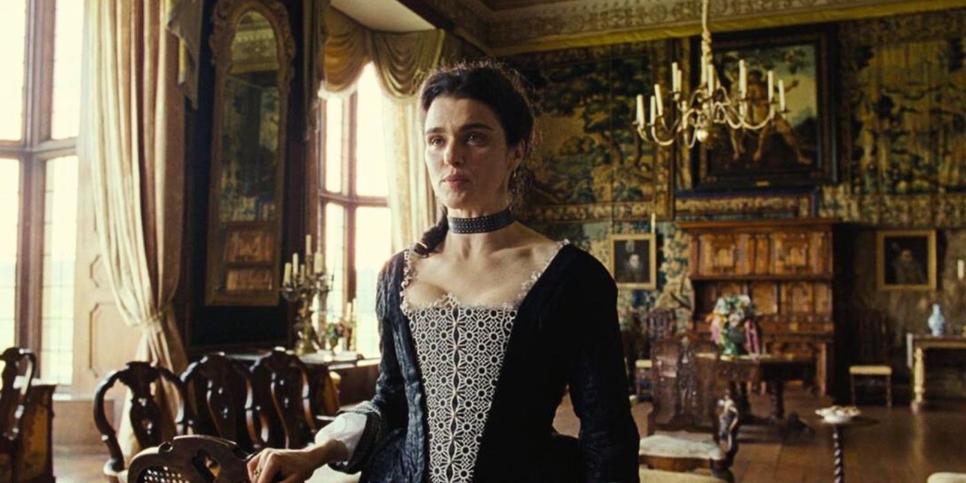 Rachel Weisz at the table in The Favorite