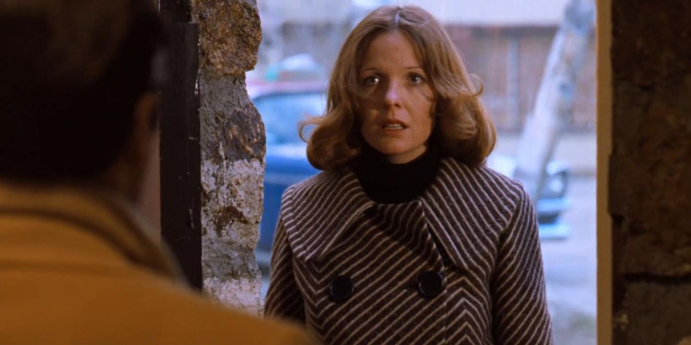 Diane Keaton as Kay Adams looks shocked as she stands in front of someone in The Godfather Part 2.