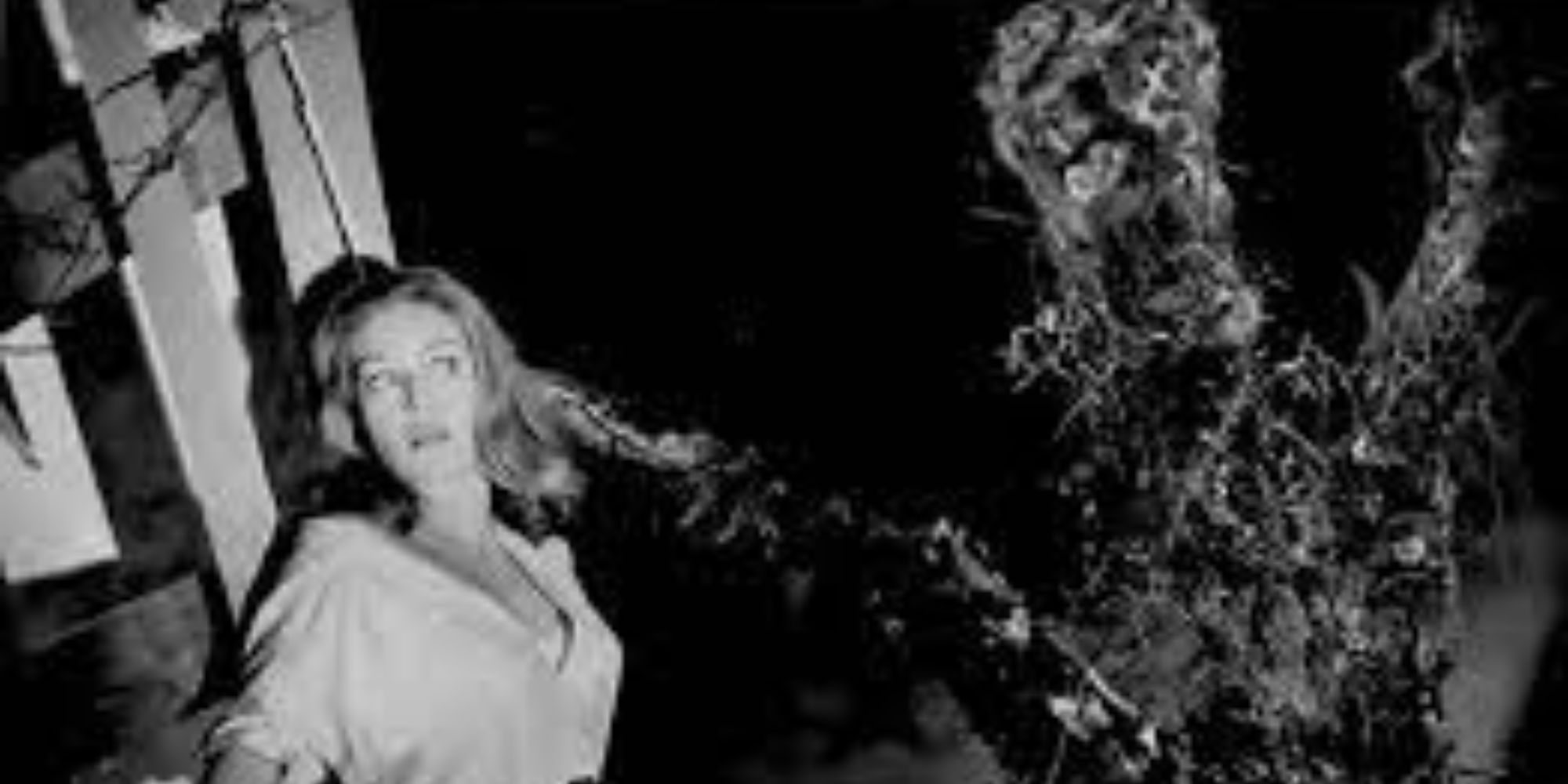 Nicole Maury and a triffid from the movie Day of the Triffids, 1963