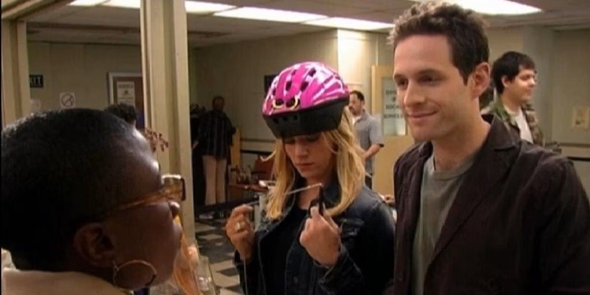 Dee (Kaitlin Olson) and Dennis (Glenn Howerton) at the welfare office on It's Always Sunny in Philadelphia.